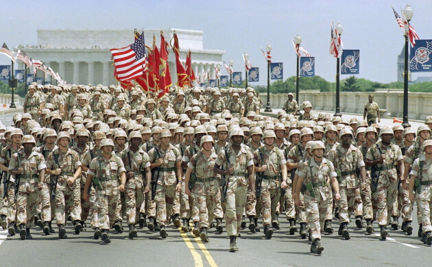 Troops march on the Memorial Bridge across the Potomac River towards the pentagon during National Victory Celebration Parade on Saturday, June 8, 1991 in Washington. The Lincoln Memorial is in the backround. (AP Photo/Doug Mills)